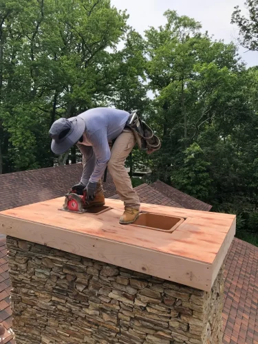 Bridger craftsman completing chimney masonry work